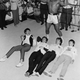 As Clay flays his chest "Tarzan Style" the Beatles are prostrate on the floor. The quintet clowned for photographers during a visit to the 5th street gym 2/18.
Getty Images